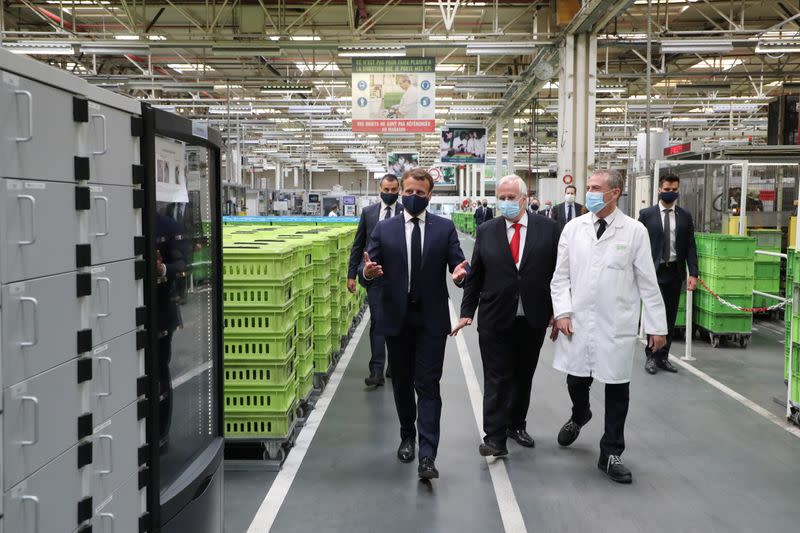 French President Emmanuel Macron visits a factory of manufacturer Valeo, in Etaples