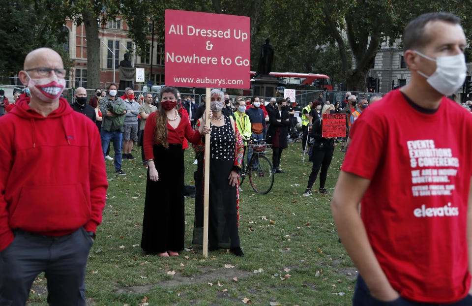 Workers from the event industry protest at Parliament Square in London, Tuesday, Sept. 29, 2020, demanding help for their industry after the shutdown due to the coronavirus outbreak. (AP Photo/Frank Augstein)