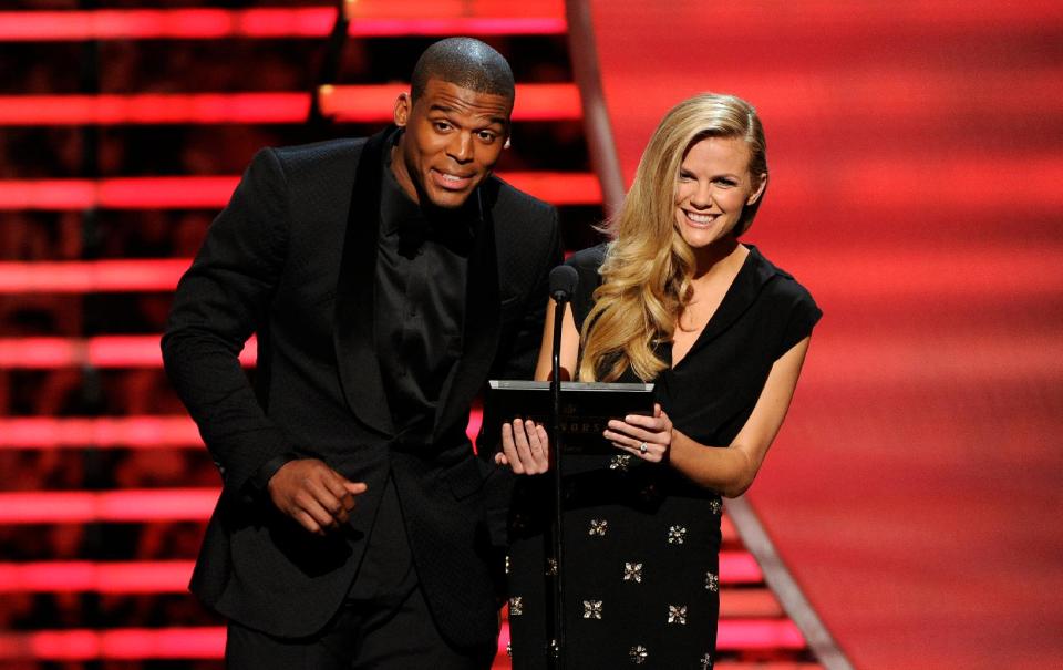 Carolina Panthers' Cam Newton, left, and model Brooklyn Decker speak on stage at the thirrd annual NFL Honors at Radio City Music Hall on Saturday, Feb. 1, 2014, in New York. (Photo by Evan Agostini/Invision for NFL/AP Images)