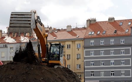 An excavator is used during works at New Nuselska project in Prague