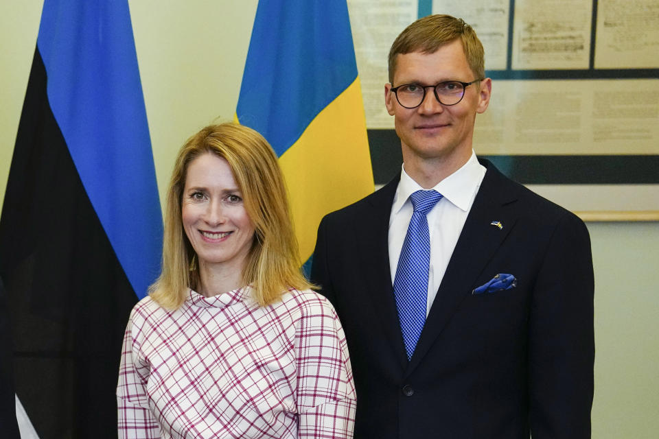 FILE - Estonian Prime Minister Kaja Kallas, left, and her husband Arvo Hallik pose for a picture in Tallinn, Estonia, on May 2, 2023. The husband of Estonia’s government leader said Friday Aug. 25, 2023 he will the sell stakes in a company with ties to Russia, a situation that has caused a crisis for Estonian Prime Minister Kaja Kallas, one of Europe’s most outspoken supporters of Ukraine. (AP Photo/Pavel Golovkin, File)