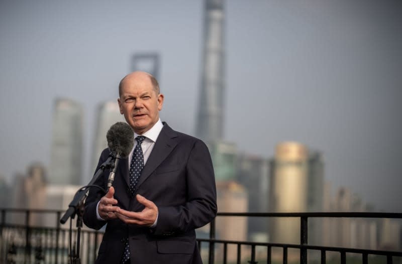 Germany's Chancellor Olaf Scholz speaks during a press statement in Shanghai. Scholz is scheduled to meet China's President Xi Jinping in Beijing at the end of his trip. Michael Kappeler/dpa