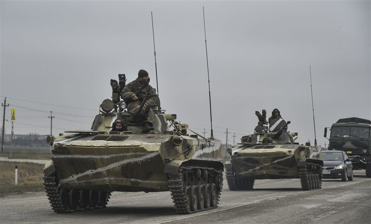 Russian soldiers move towards mainland Ukraine on the road near Armiansk, Crimea (EPA)