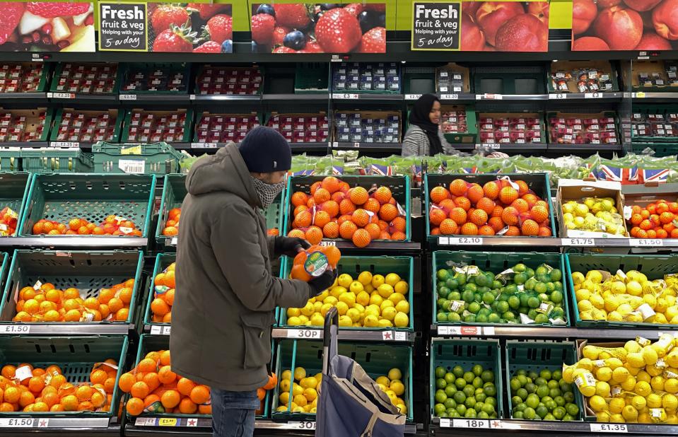 A customer shops for food items inside a Tesco supermarket store in east London on January 10, 2022. - UK annual inflation rocketed last November to 5.1 percent, more than double the Bank of England's 2.0-percent target -- price rises for fuel, clothing, food, second-hand cars and increased tobacco duty all helped drive up inflation. (Photo by Daniel LEAL / AFP) (Photo by DANIEL LEAL/AFP via Getty Images)