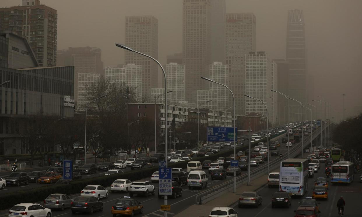 <span>Dust and sand pollution causes smog in Beijing.</span><span>Photograph: Wu Hong/EPA</span>