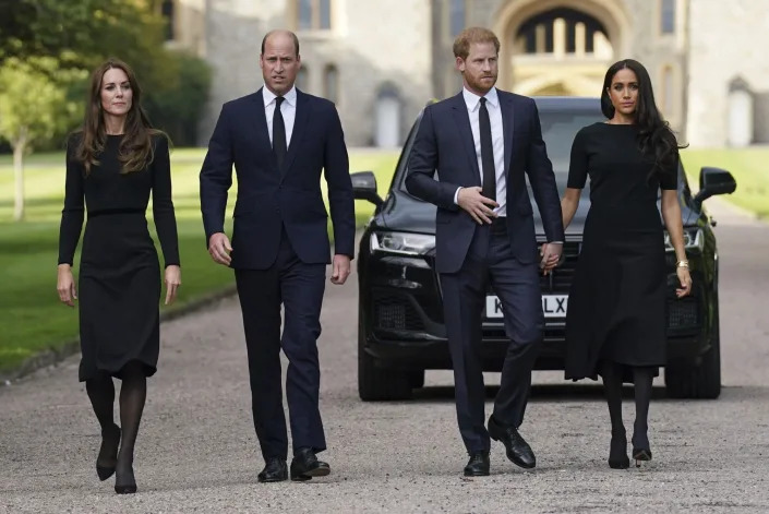 Mandatory Credit: Photo by Kirsty O&#39;Connor/AP/Shutterstock (13381259a) From left, Kate, the Princess of Wales, Prince William, Prince of Wales, Prince Harry and Meghan, Duchess of Sussex walk to meet members of the public at Windsor Castle, following the death of Queen Elizabeth II on Thursday, in Windsor, England Royals, Windsor, United Kingdom - 10 Sep 2022