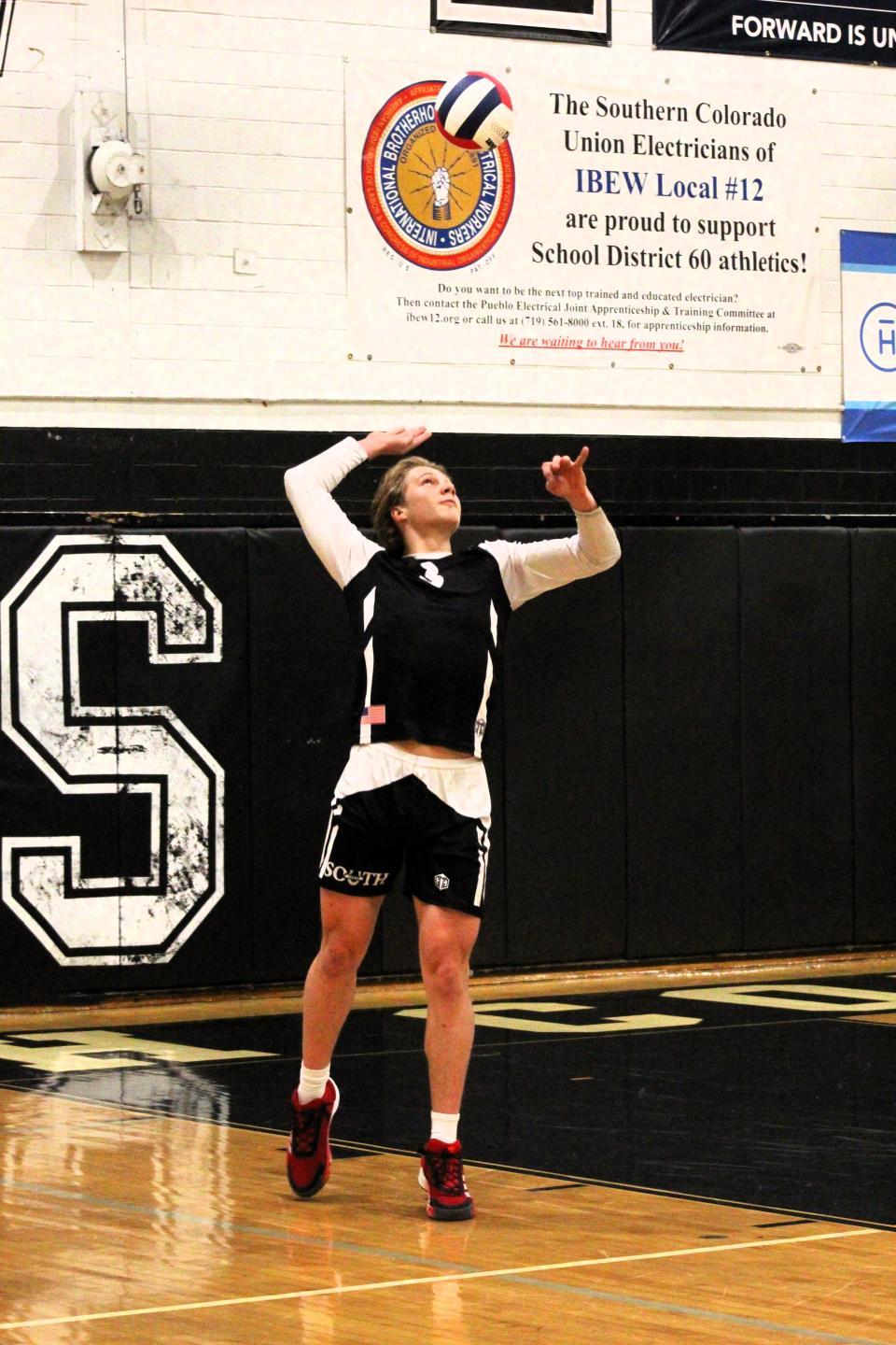 Pueblo South Colts Evan Budd launches the ball in the air on his serve against Cheyenne Mountain at Pueblo South High School on Tuesday, Mar 5, 2024.