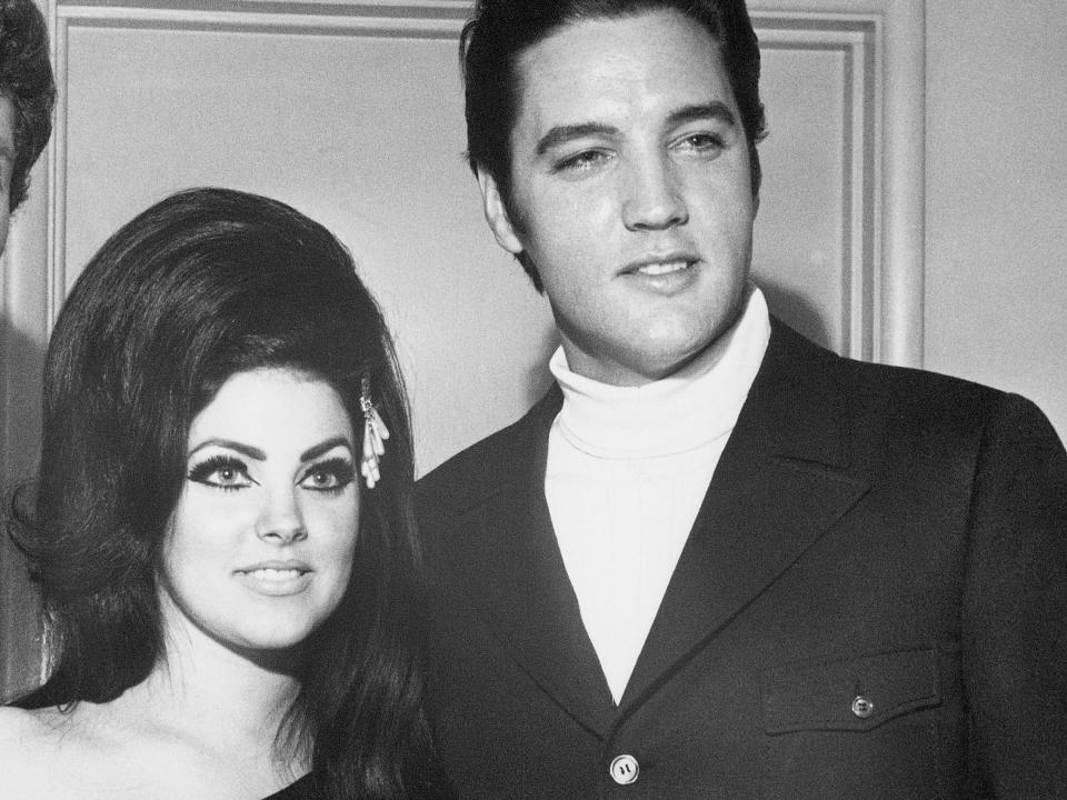 4/7/1968-Las Vegas, NV- Britain's hottest current singing star, Tom Jones (L), often compared to the early Elvis Presley in style and appeal to femininity, poses with Presley and his wife Priscilla, backstage at the Flamingo Hotel in Las Vegas, where Presley witnessed and cheered to a Tom Jones performance.