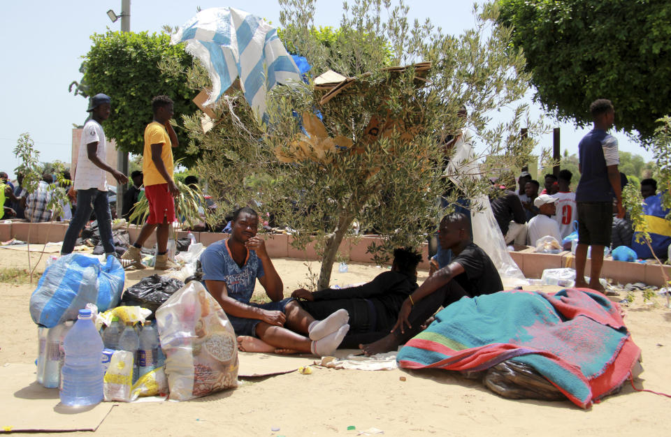 Migrants rest during a gathering in Sfax, Tunisia's eastern coast, Friday, July 7, 2023. Tensions spiked dangerously in a Tunisian port city this week after three migrants were detained in the death of a local man, and there were reports of retaliation against Black foreigners and accounts of mass expulsions and alleged assaults by security forces. (AP Photo)