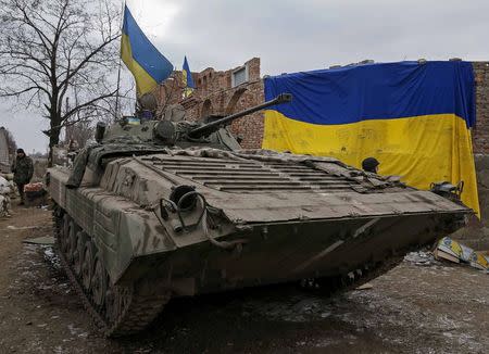 An armoured personnel carrier of the Ukrainian armed forces is seen near Debaltseve, eastern Ukraine, February 20, 2015. REUTERS/Gleb Garanich