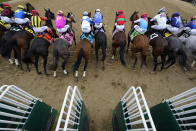 Horses break from the starting gate at the 148th running of the Kentucky Derby horse race at Churchill Downs Saturday, May 7, 2022, in Louisville, Ky. (AP Photo/Brynn Anderson)