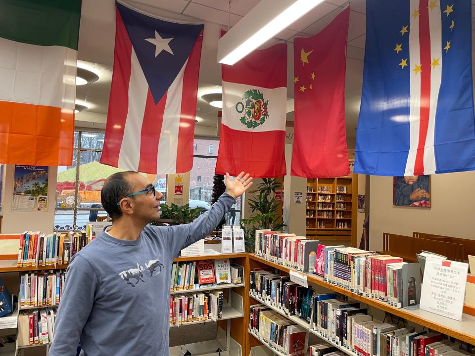 Otis Library Multicultural Services Coordinator Bassam Gayed shows the flags of some of the cultures and nationalities represented among Norwich's residents. When the cultural calendar is added to the city's website, he can reference it when planning the library's cultural activities.
