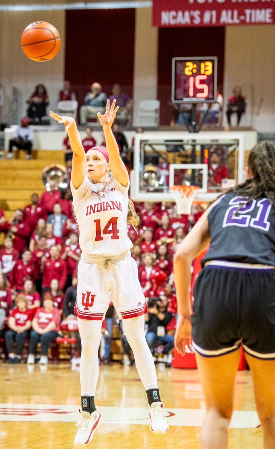 Indiana's Sara Scalia (14) shoots a three-pointer during the second half of the Indiana versus Lipscomb women's basketball game at Simon Skjodt Assembly Hall on Sunday, Nov. 19, 2023.