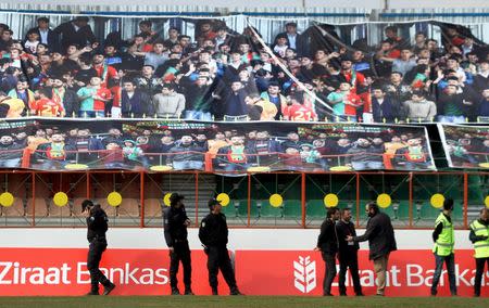 Turkish riot police stand in front of the emty tribune of the Seyrantepe DISKI stadium before the Turkish Cup quarter final first leg soccer match between Amedspor and Fenerbahce in the Kurdish-dominated southeastern city of Diyarbakir, Turkey February 9, 2016. REUTERS/Sertac Kayar