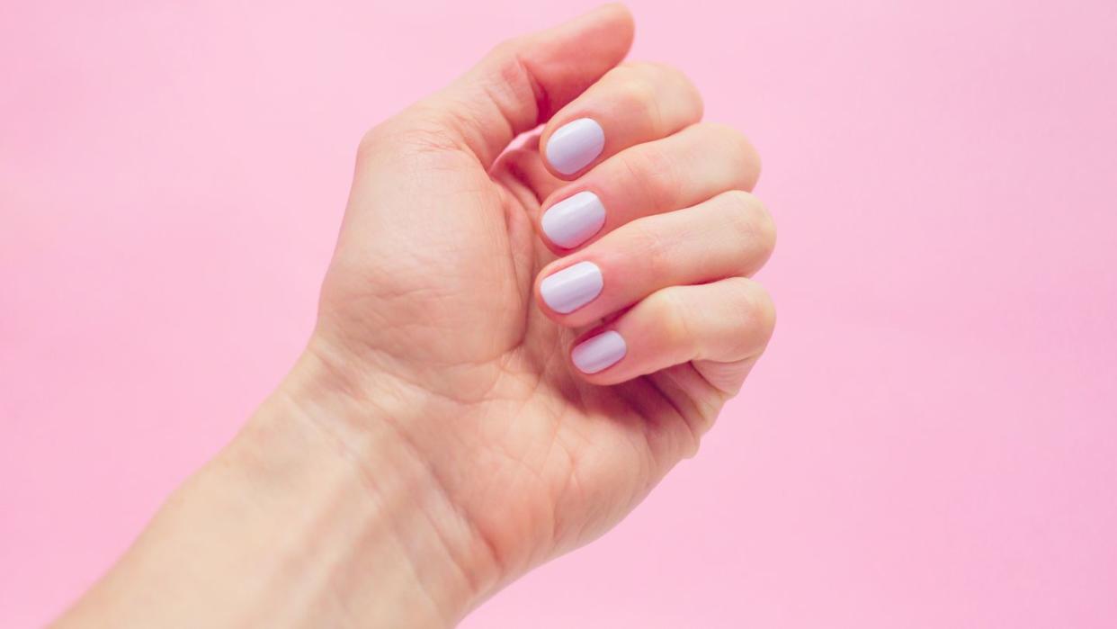 pastel nails, pastel nail polish, lavender nail color on pink background