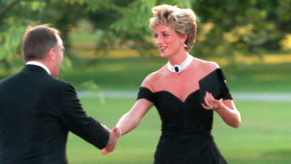Diana, the late Princess of Wales attends a Vanity Fair party at the Serpentine Gallery in Nov 1994. The famous black "revenge dress" was a spectacular coup by the popular royal, worn on the very evening that then-Prince Charles made his notorious adultery admission on television. - Anwar Hussein