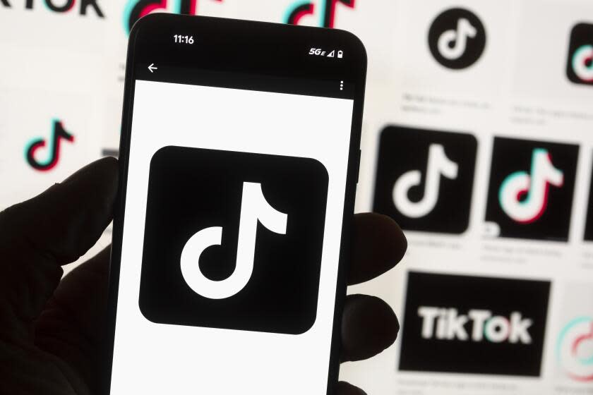 FILE - The TikTok logo is seen on a cell phone on Oct. 14, 2022, in Boston. North Carolina Gov. Roy Cooper's administration said it is reviewing the use of TikTok on state government devices, as the popular social media app is a growing source of security concerns from politicians in Washington and other states. (AP Photo/Michael Dwyer, File)