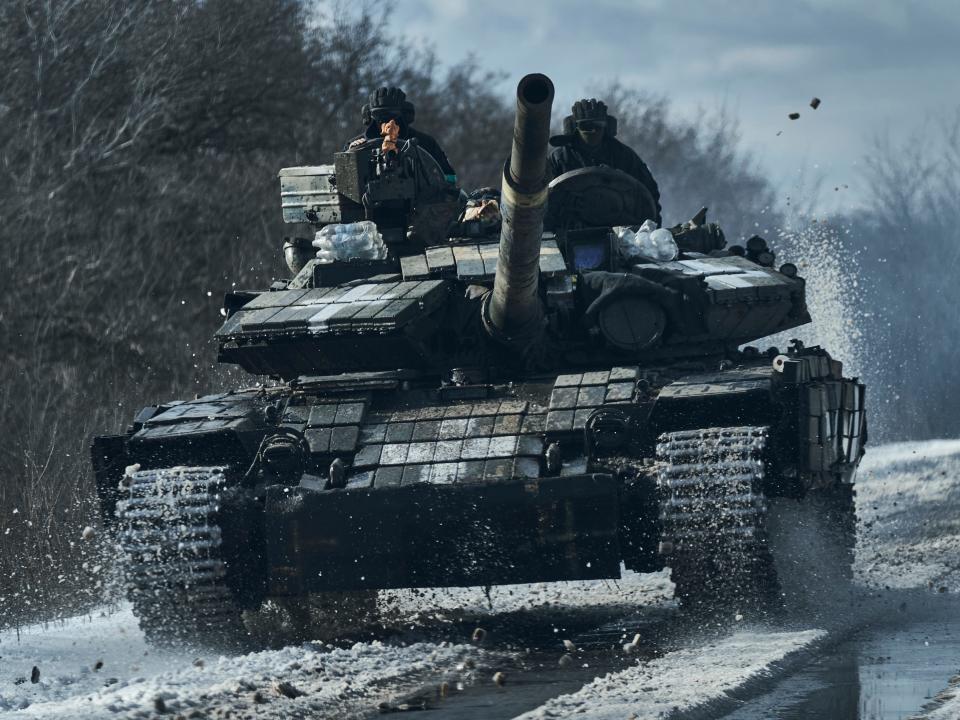 Ukrainian soldiers ride atop a tank in the frontline in Bakhmut, Donetsk region, Ukraine, Monday, Feb. 20, 2023.