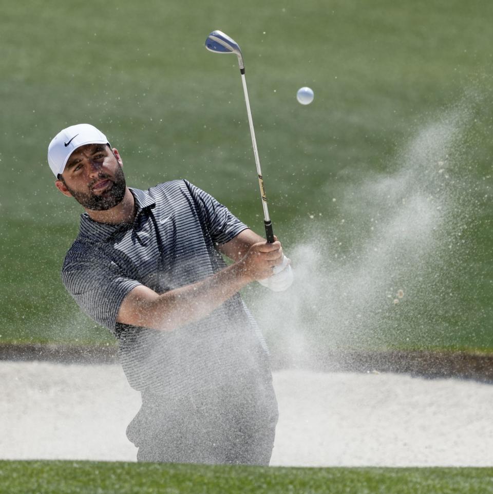Apr 8, 2024; Augusta, Georgia, USA; Scottie Scheffler hits out of a bunker on no. 18 during a practice round for the Masters Tournament golf tournament at Augusta National Golf Club. Mandatory Credit: Michael Madrid-USA TODAY Network