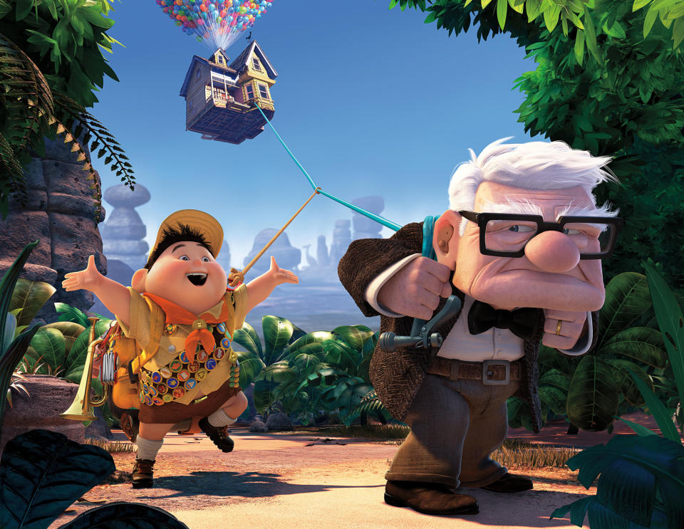 Russell singing and walking behind Carl Fredricksen who is pulling his house attached on a string