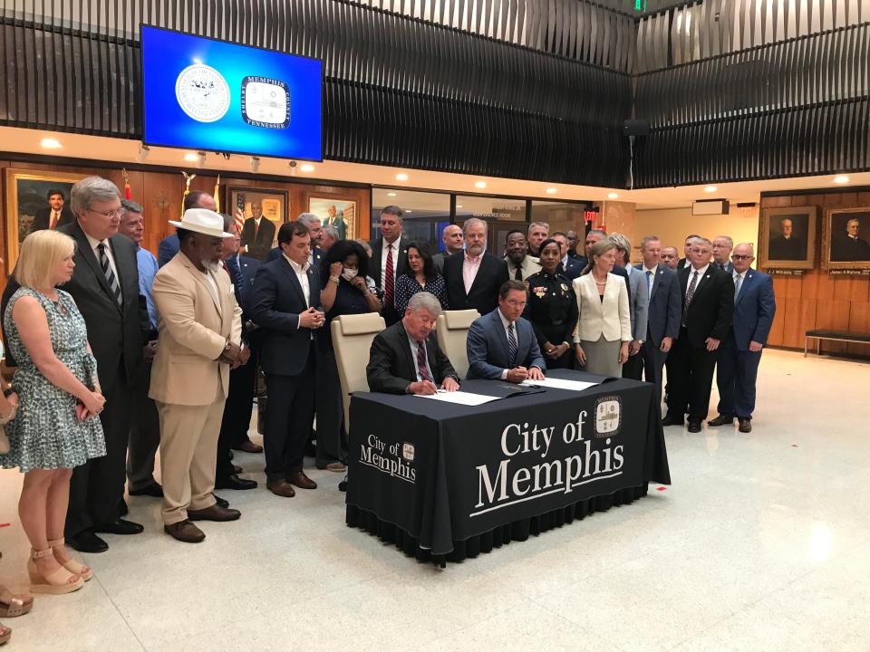Tennessee Lt. Gov. Randy McNally and House Speaker Cameron Sexton sign truth-in-sentencing legislation during a ceremony at Memphis City Hall, Thursday, June 23, 2022.