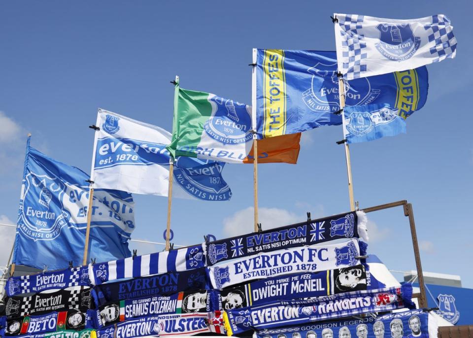 Everton flags and scarves on sale outside Goodison Park (PA)