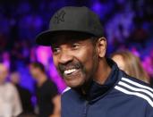 Actor Denzel Washington smiles as he sits ringside while waiting for the welterweight WBO, WBC and WBA (Super) title fight between Manny Pacquiao of the Philippines and Floyd Mayweather, Jr. of the U.S. in Las Vegas, Nevada, May 2, 2015. REUTERS/Steve Marcus