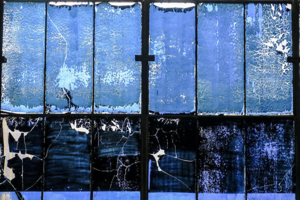 Blue film covering the windows at General Electric's abandoned manufacturing plant