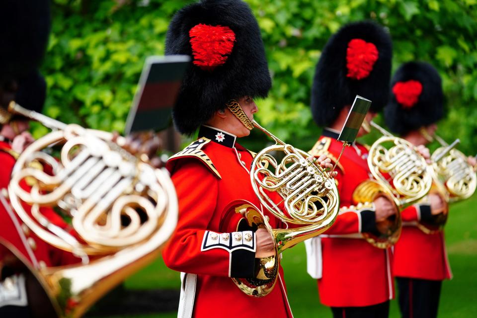 The Band of the Coldstream Guards plays 'Three Lions' and 'Sweet Caroline' in the gardens of Clarence House in London on July 6, 2021, ahead of England's UEFA EURO 2020 semi-final football match against Denmark on July 7. (Photo by Victoria Jones / POOL / AFP) (Photo by VICTORIA JONES/POOL/AFP via Getty Images)