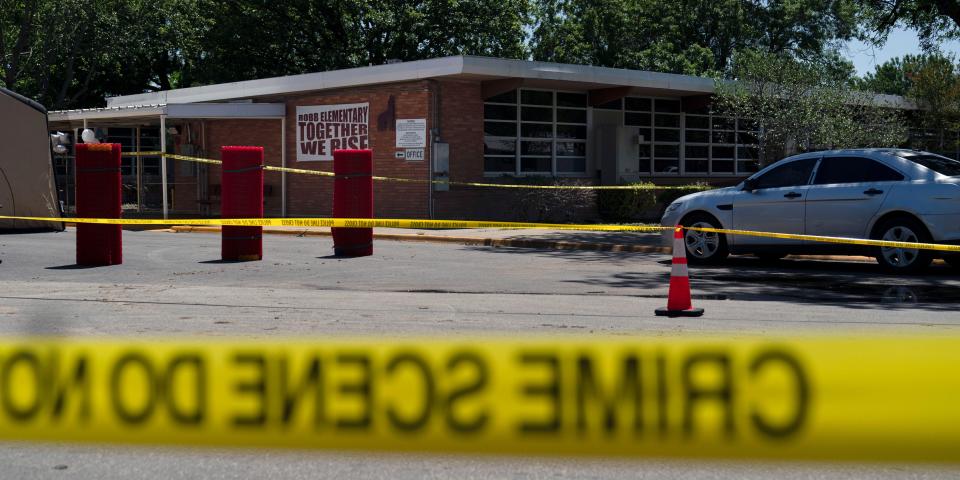 Crime scene tape surrounds Robb Elementary School in Uvalde, Texas, Wednesday, May 25, 2022.