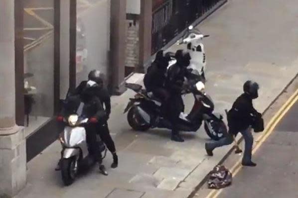 The robbers were seen leaving the shop wielding hammers before speeding off on mopeds: Twitter/@f0od1samazing