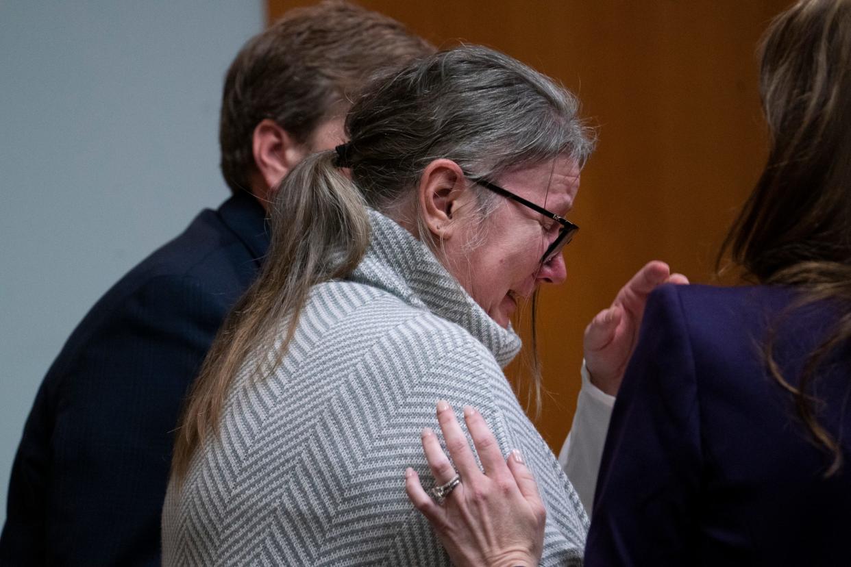 Jennifer Crumbley becomes extremely emotional after seeing video of her son walking through Oxford High School during his shooting rampage in Nov. 30, 2021. Crumbley is consoled by her attorney Shannon Smith in the courtroom of Oakland County Judge Cheryl Matthews on Thursday, Jan. 25, 2024.