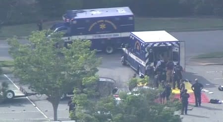 Paramedics prepare a staging area for victims in this still image from video following a shooting incident at the municipal center in Virginia Beach