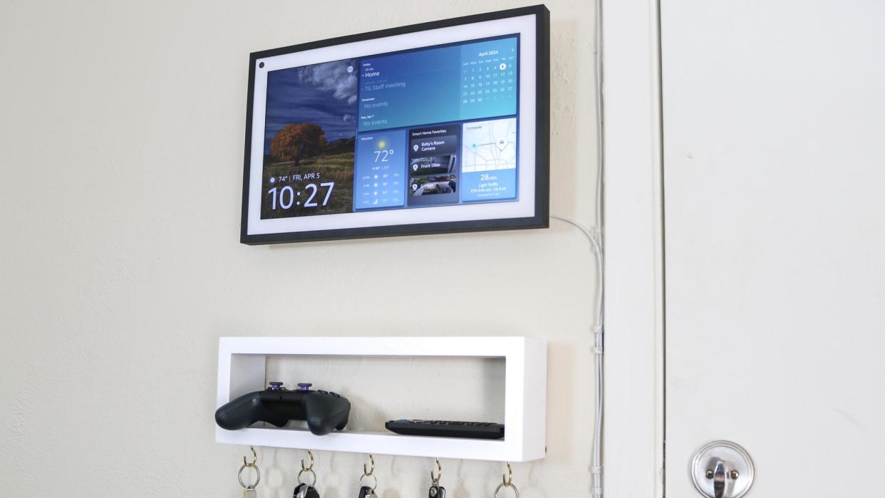  An Echo Show 15 in landscape mode mounted to the wall. 