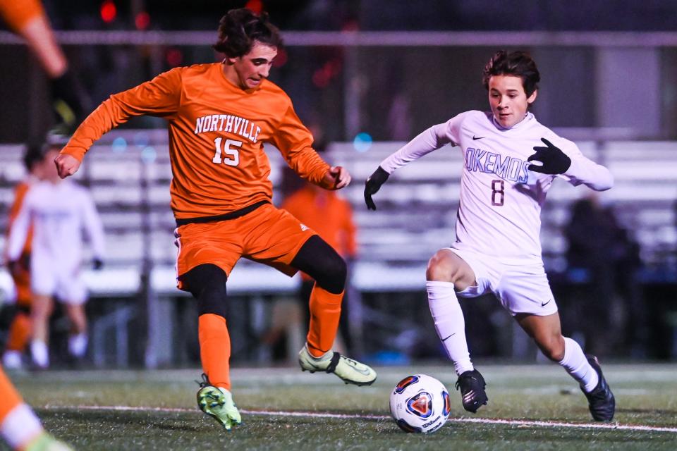 Okemos' Leo Arana, right, moves the ball as Northville's Moreno Scaccia defends during the first half on Wednesday, Nov. 3, 2021, at Grand Ledge High School.