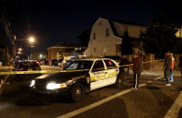 <p>A police cruiser stands at the corner of Getty Avenue and Genessee Avenue as officials inspect a home Tuesday, Oct. 31, 2017, in Paterson, N.J. (Photo: Julio Cortez/AP) </p>