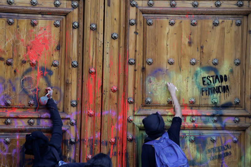 People take part in a protest against gender-based violence in downtown of Mexico City