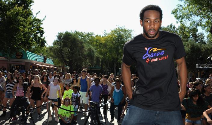 Stephen tWitch Boss dancing behind a crowd