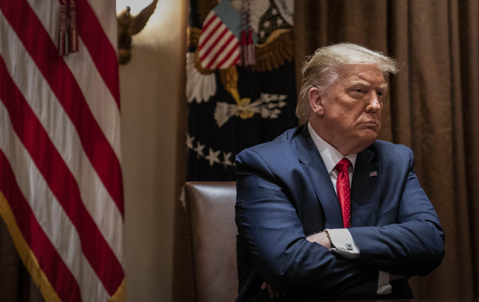 File - President Donald Trump listens during a White House meeting with Hispanic leaders, Thursday, July 9, 2020, in Washington. Trump's lawyers filed fresh arguments Monday to try to block or severely limit a criminal subpoena for his tax records, calling it harassment of the president. (AP Photo/Evan Vucci, File)