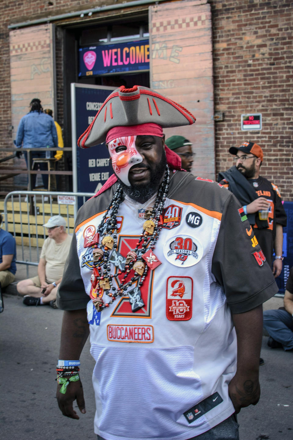 Tampa native and Buccaneer fan Jamal Sanders supports his team during the NFL Draft, Friday, April 26, 2019 in Nashville, Tenn. While it isn't unusual for fans who cheer for the same teams to bond at the NFL Draft, several super fans in Nashville for Friday's second and third rounds have enjoyed getting to know fans of teams they will be rooting against when the season kicks off in the fall. (AP Photo/Jim Diamond)