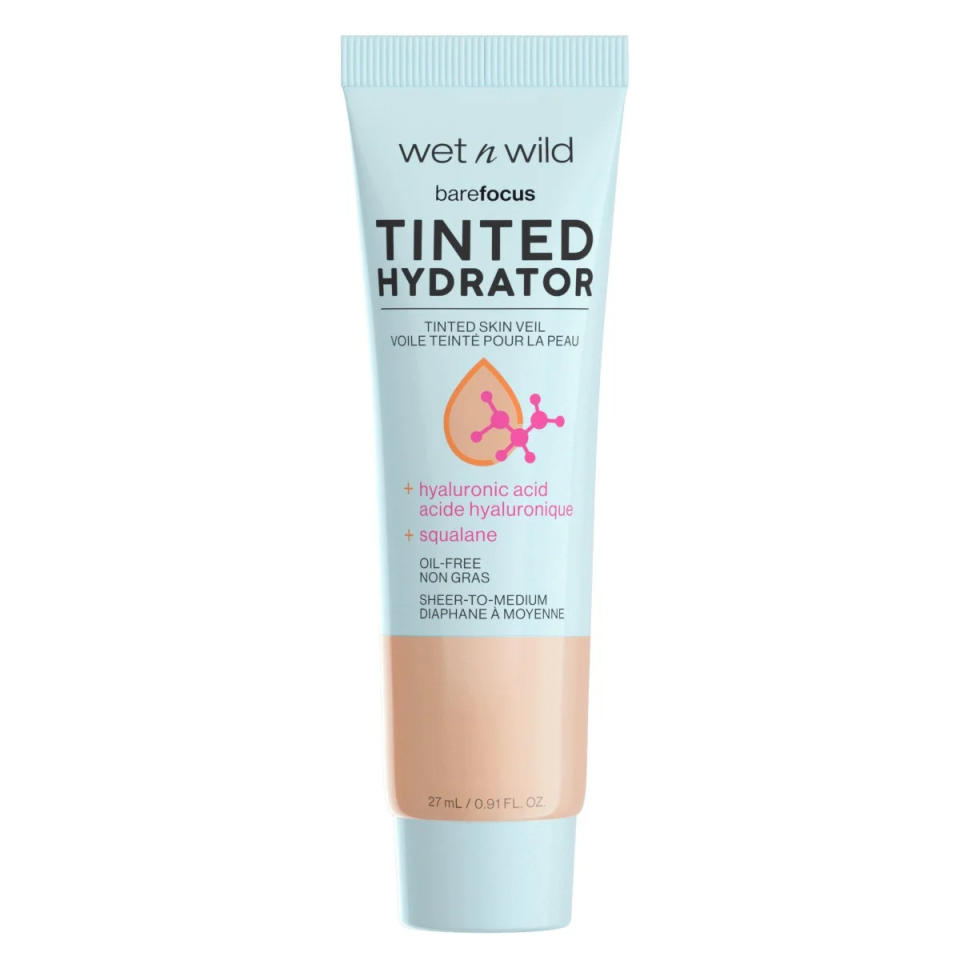 Give the Wet N Wild Bare Focus Tinted Hydrator a whirl this summer for a budget-friendly option. This tinted moisturizer offers light coverage that’s buildable and leaves your skin feeling hydrated. The formula is packed with Hyaluronic Acid and vegan squalane so it’s a great skin-care product as well. 
