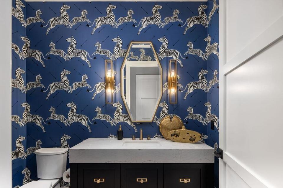 A playful wallpaper in the powder room