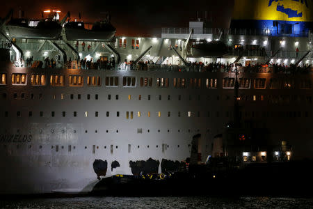 A tugboat approaches the damaged Eleftherios Venizelos ferry during a fire on the ferry, at the port of Piraeus, Greece, August 29, 2018. REUTERS/Alkis Konstantinidis