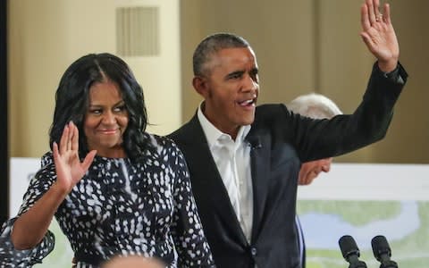 Michelle Obama with her husband in Chicago in May - Credit: EPA
