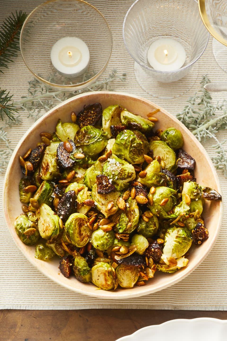 <p>Figs bring a natural sweetness this sprout side. </p><p>Get the <a href="https://www.goodhousekeeping.com/food-recipes/healthy/a25323337/brussels-sprouts-with-pepitas-and-figs-recipe/" rel="nofollow noopener" target="_blank" data-ylk="slk:Brussels Sprouts with Pepitas and Figs recipe" class="link "><strong>Brussels Sprouts with Pepitas and Figs recipe</strong></a>.</p>