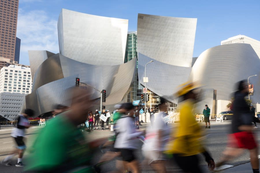 LOS ANGELES, CA MARCH 17: Runners pass Walt Disney Concert Hall at the four-mile mark during the LA Marathon on Sunday, March 17, 2024. Over 25,000 runners competed this year. (Myung J. Chun / Los Angeles Times via Getty Images)