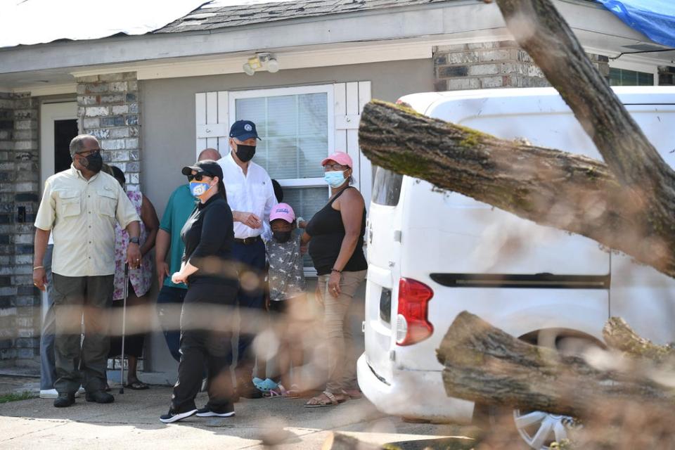 President Joe Biden tours a neighbourhood affected by Hurricane Ida in LaPlace, Louisiana on Friday (AFP)