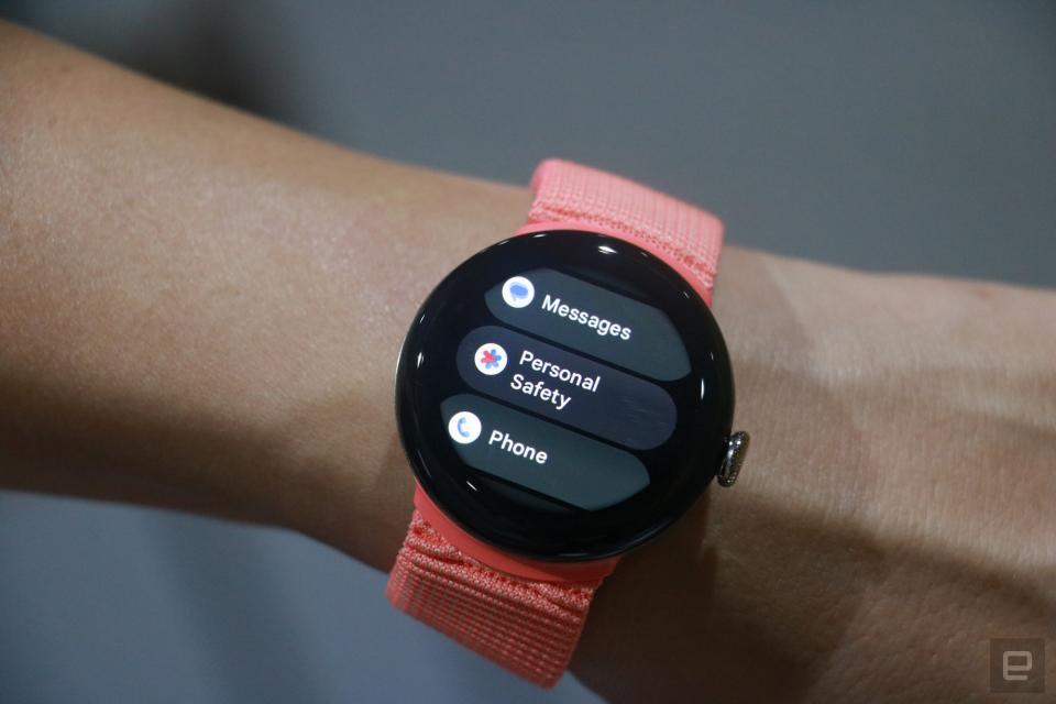 The Pixel Watch 2 on a person's wrist, showing a list of apps on its screen. Just three are in the scene, and they are 