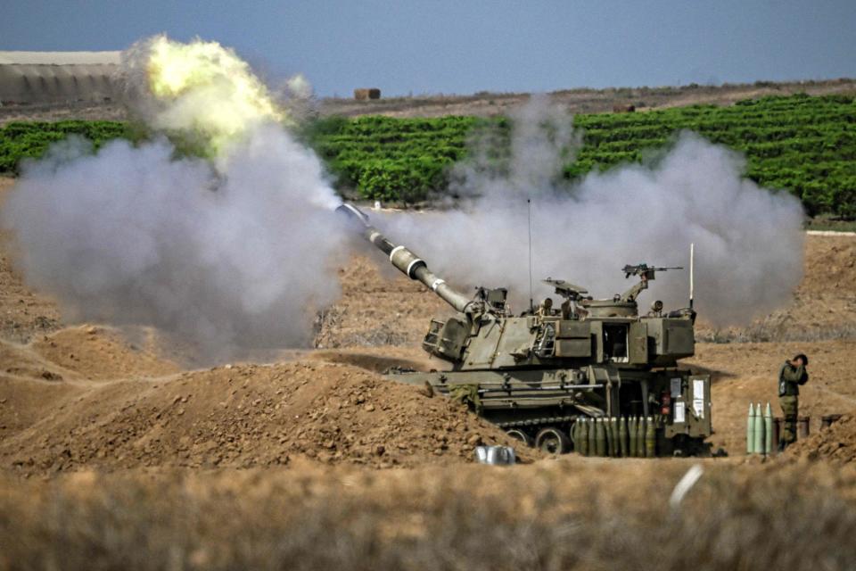 Israeli artillery unit fire towards the Gaza Strip in southern Israel on Oct. 13, 2023, as battles between Israel and the Palestinian Hamas movement continue for the seventh consecutive day. Thousands of people, both Israeli and Palestinians, have died since Oct. 7, 2023, after Palestinian Hamas militants entered Israel in a surprise attack, leading Israel to declare war on Hamas in the Gaza Strip enclave on Oct. 8.