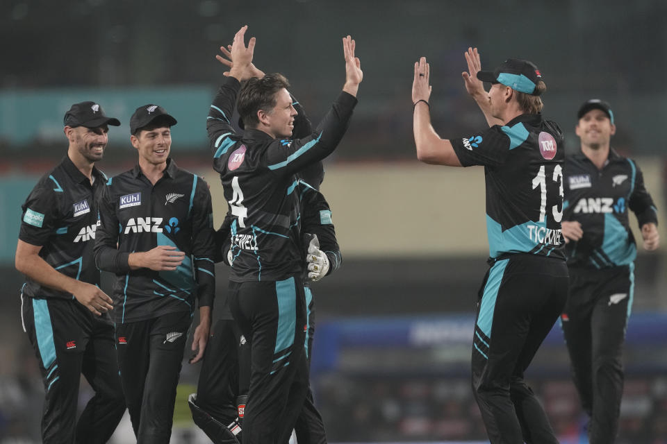 New Zealand's Michael Bracewell, center, celebrate the wicket of India's Ishan Kishan with his teammates during the first Twenty20 cricket match between between India and New Zealand in Ranchi, India, Friday, Jan. 27, 2023. (AP Photo/Bikas Das)